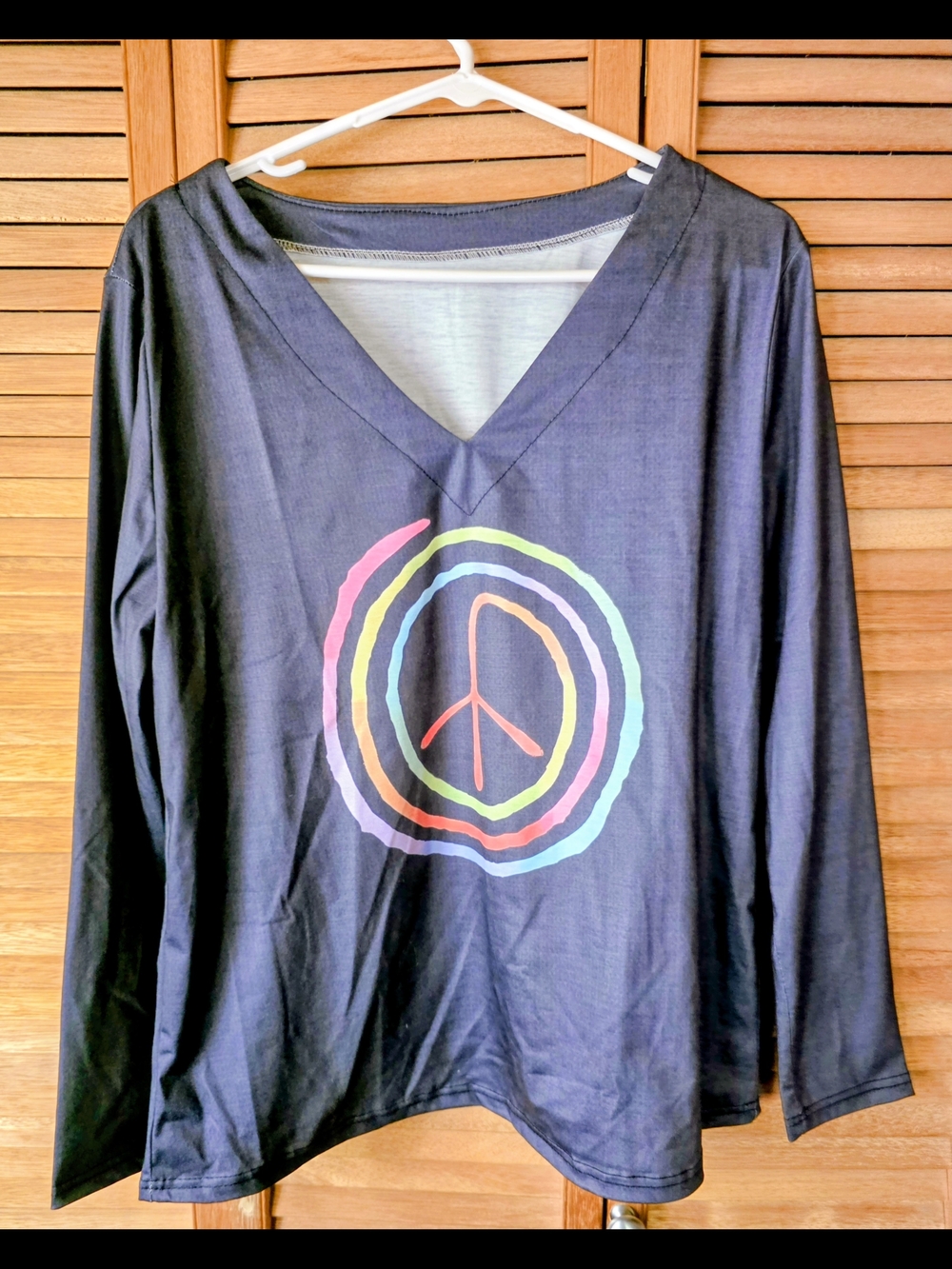 Black V-Neck Long Sleeve Tee with Multicolor Peace Graphic
